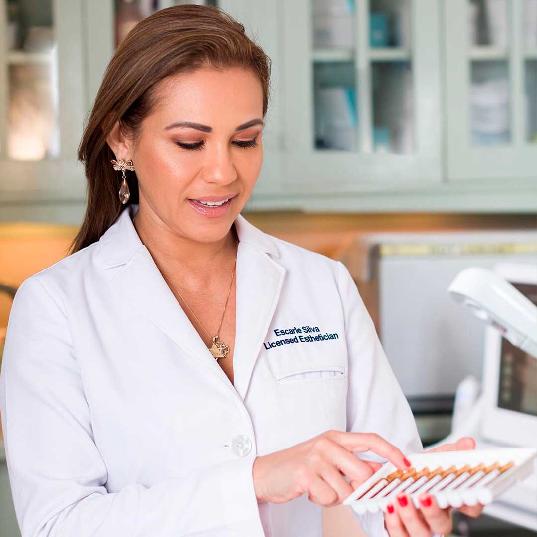 A professional woman in business attire relaxing during a luxury treatment at Alira Med Spa Houston