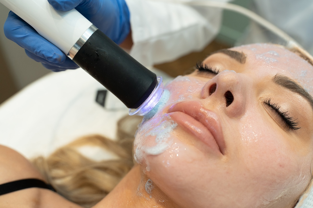 A patient enjoying a Glo2Facial session at Alira Med Spa in Houston.